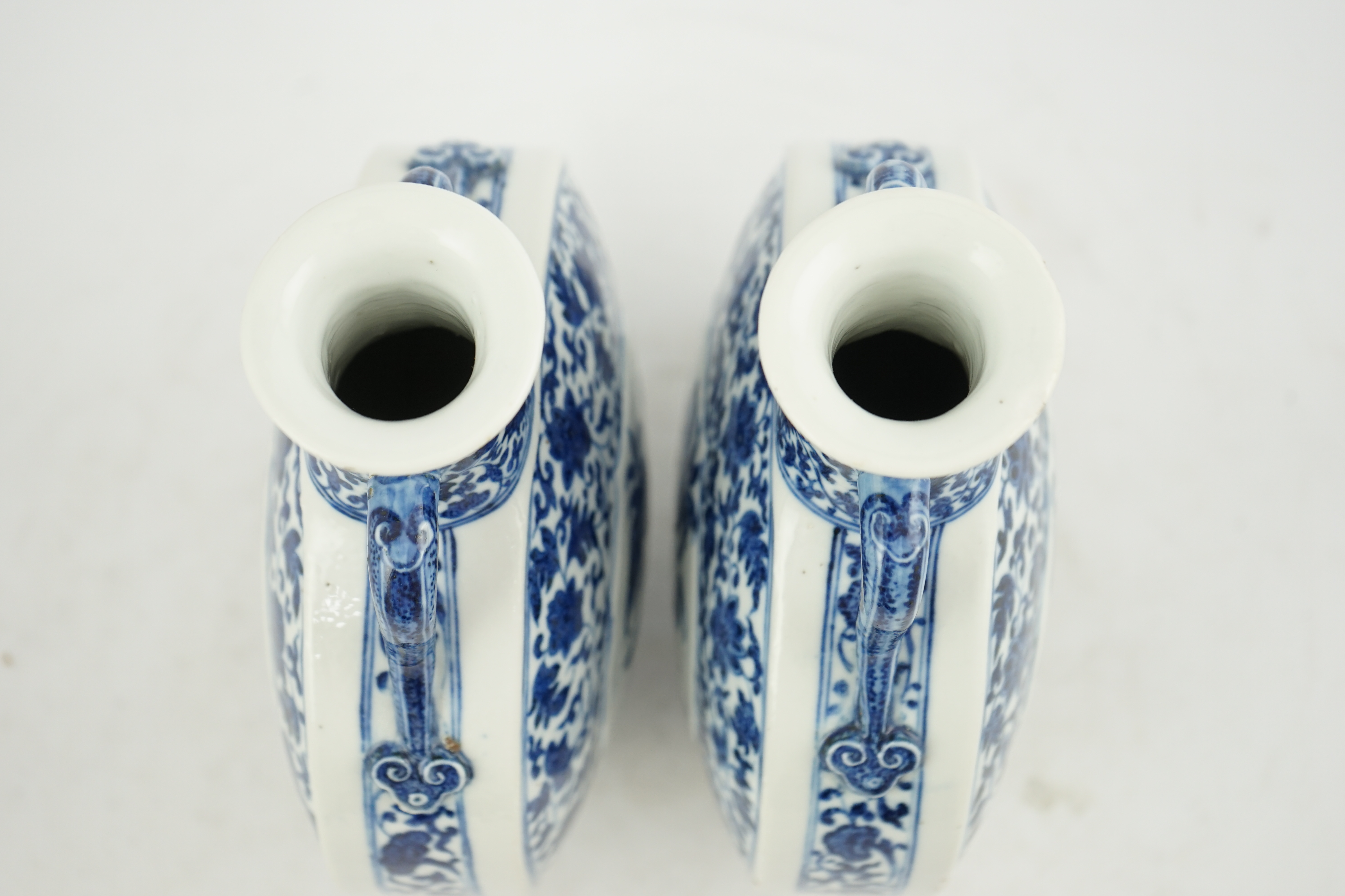 A near pair of Chinese blue and white moonflasks, bianhu, Daoguang seal marks and of the period (1821-50)